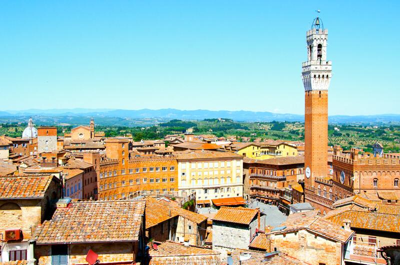 The Torre del Mangia, tower located in the ancient medieval historical city centre at Piazza del Campoin in Siena, Tuscany region, Italy